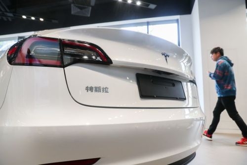 A locally made Tesla Model 3 electric car seen in a Tesla showroom in Shanghai on November 22, 2019. Photo credit: Xinhua/Ding Ting.